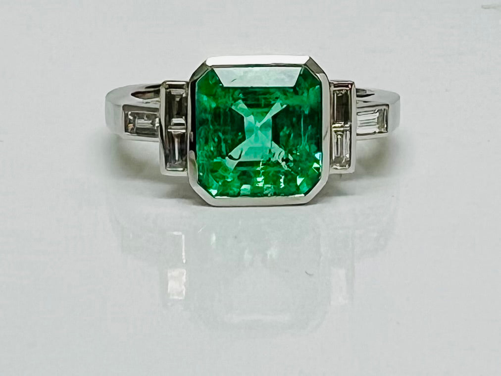 Vintage Style Emerald and Baguette Diamond Ring in Platinum